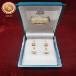 Real pearls hanging 5 designer pearl earrings.